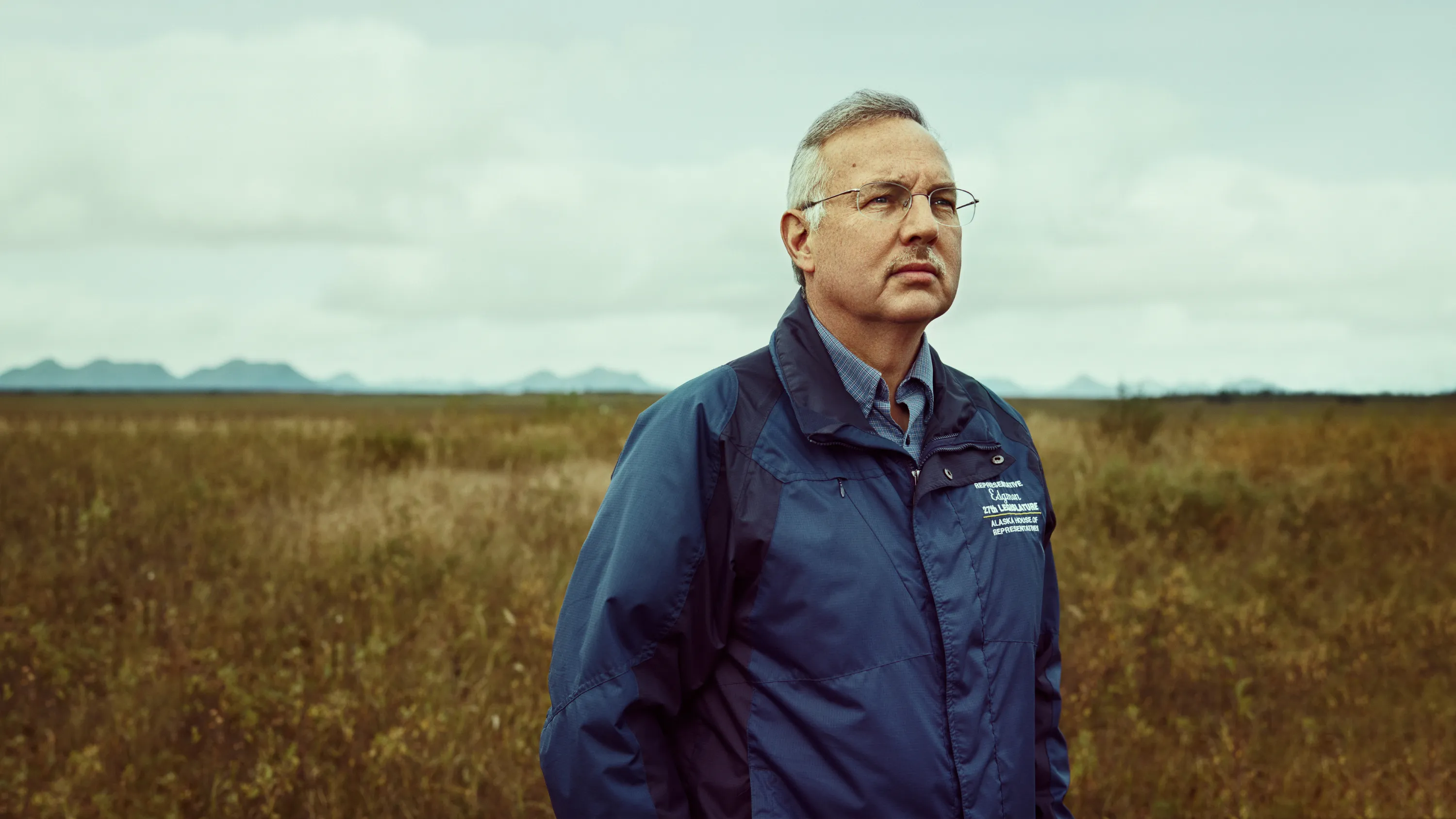 Portrait of Alaskan Senator Bryce Edgmon in a field