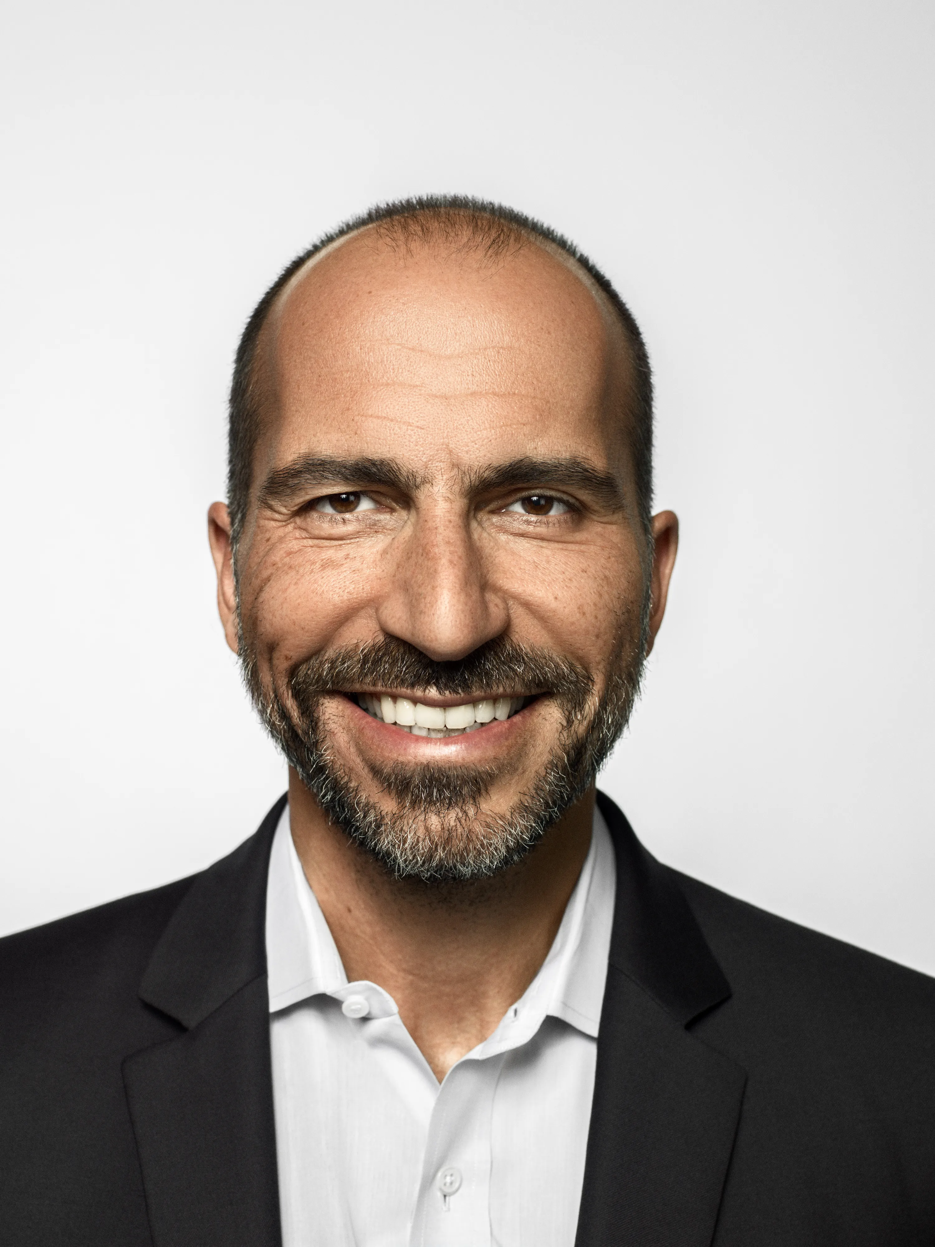 Portrait of Uber CEO in front of white background