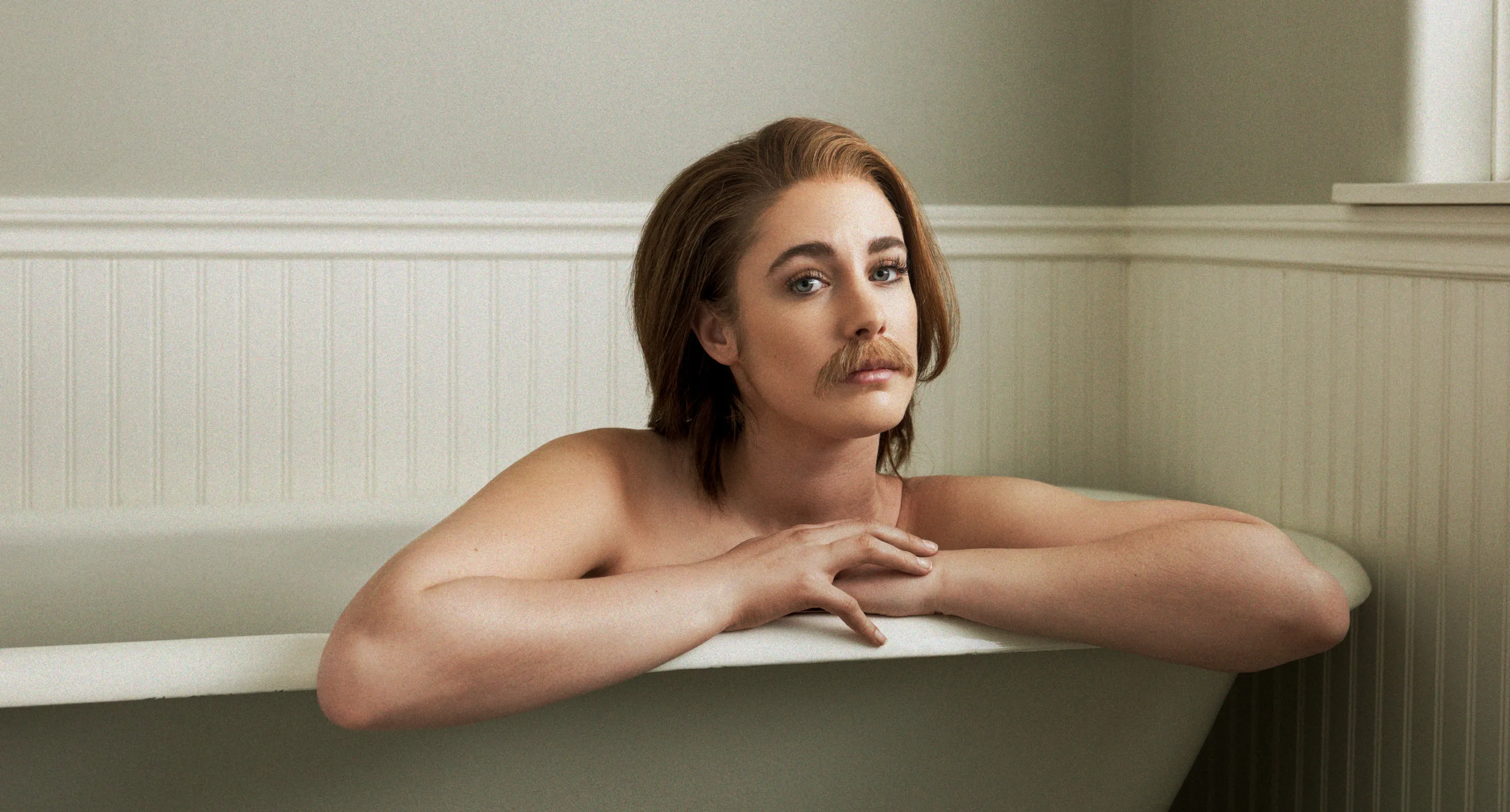 Woman in bathtub with a moustache